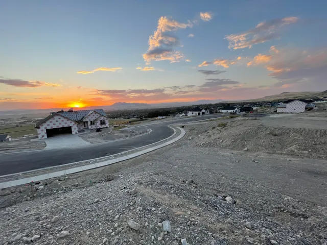 View of asphalt street featuring a mountain view