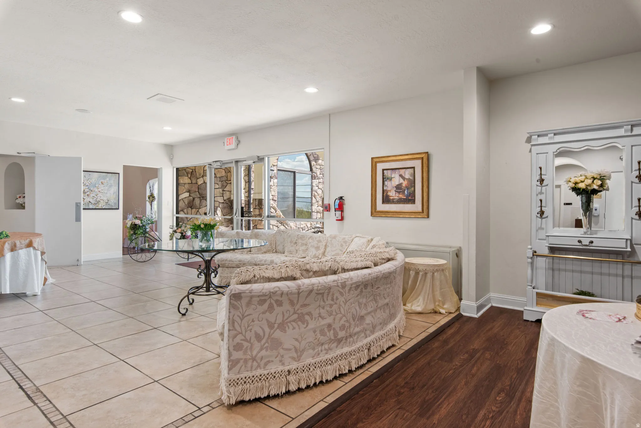 Living area with recessed lighting and baseboards