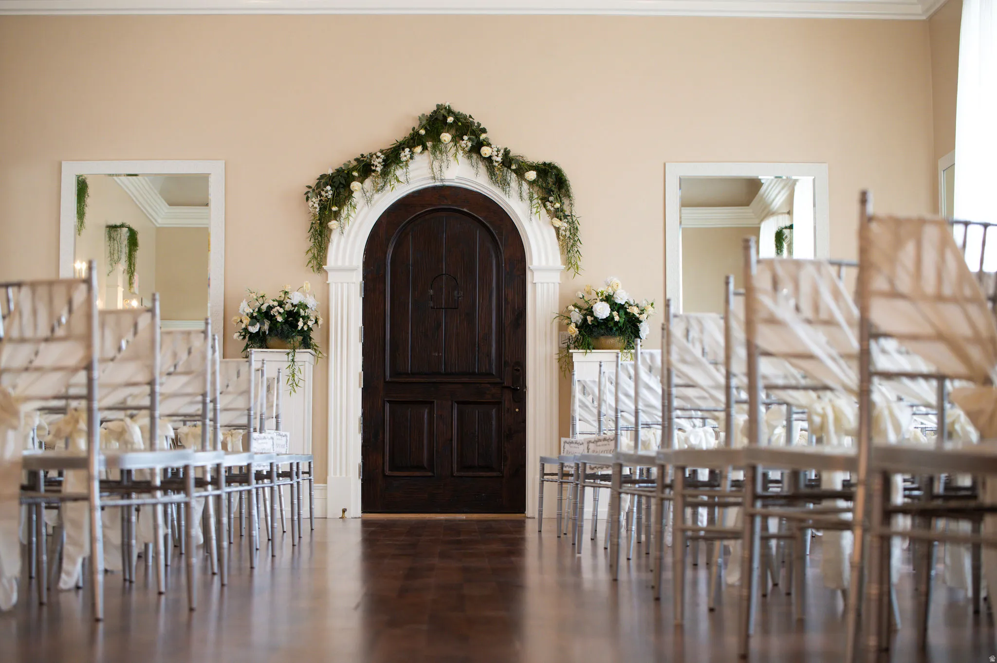 Foyer featuring ornamental molding and wood finished floors