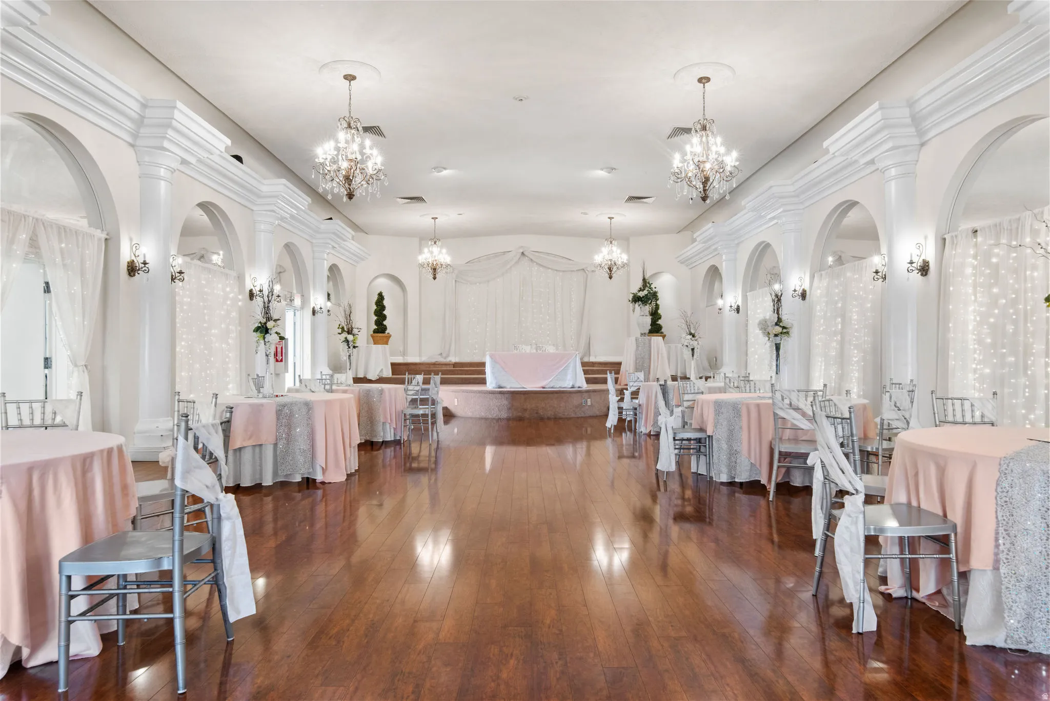 Dining area featuring dark wood-style floors