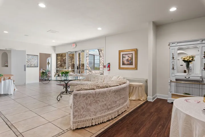 Living area with recessed lighting and baseboards
