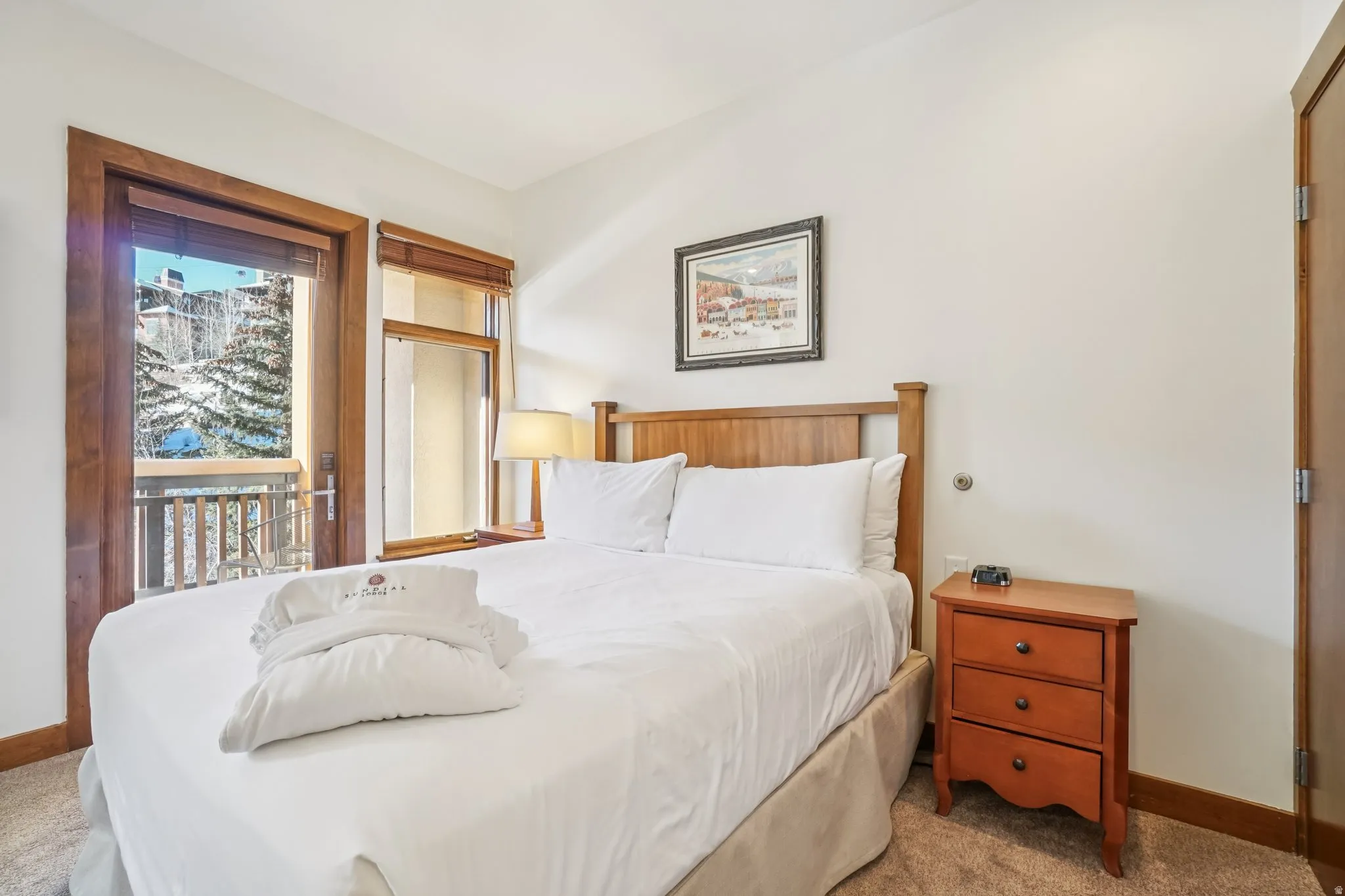 Bedroom featuring carpet flooring and access to exterior