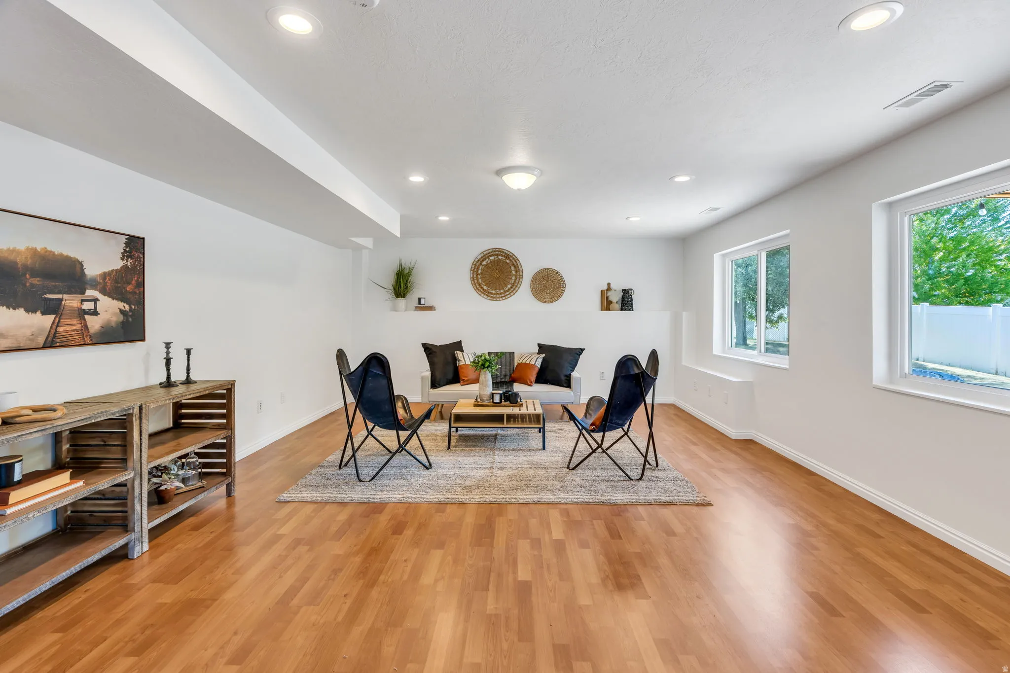 Basement family room with plumbed kitchen area, fridge and stove included
