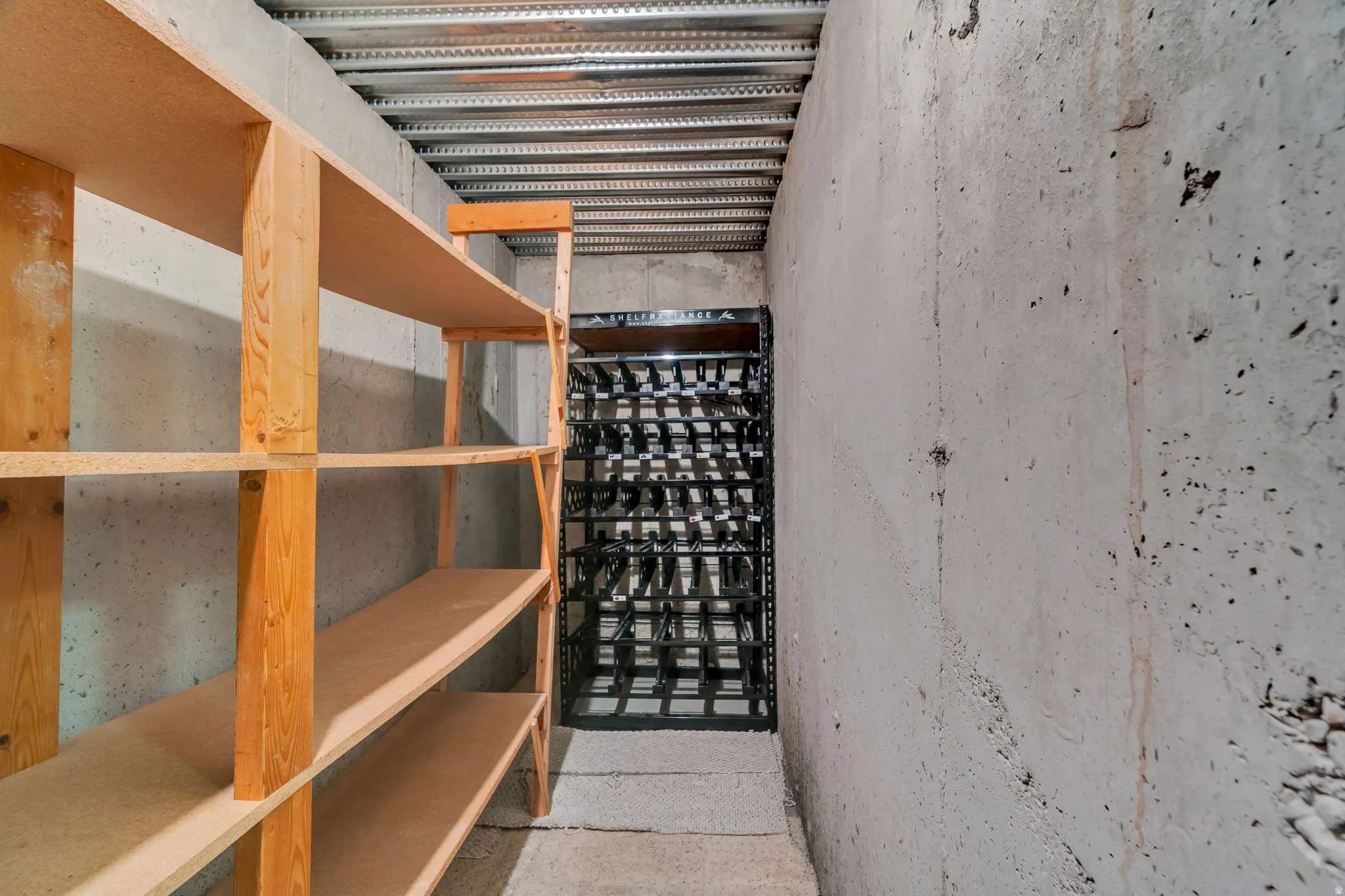 Huge cold storage room with built in shelving and additional rotating food storage shelves included.