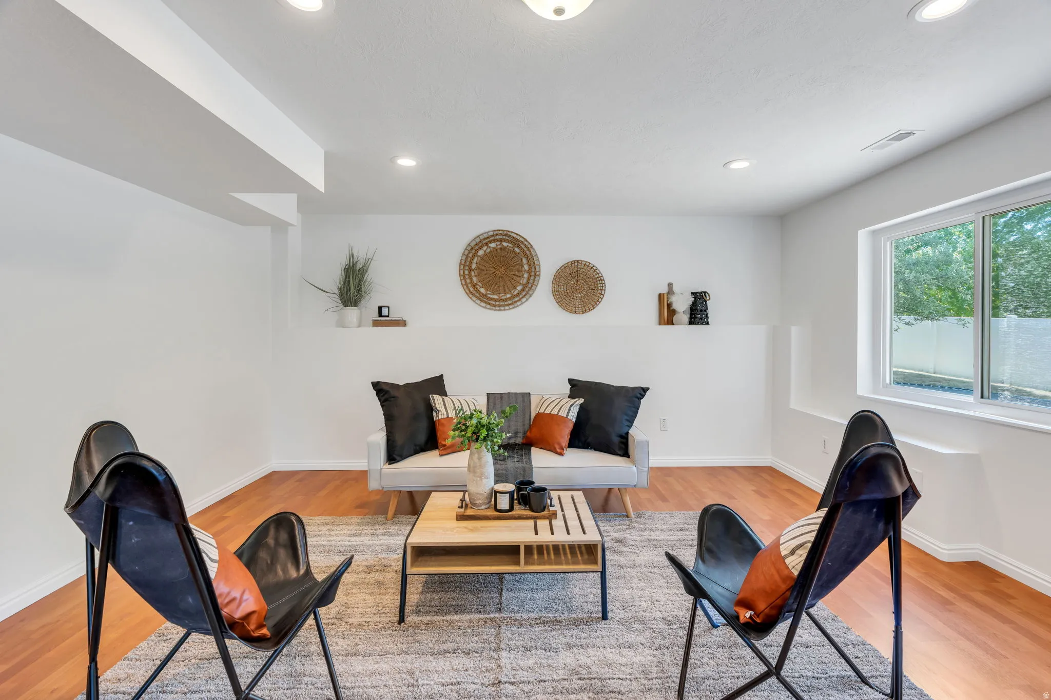 Large basement family room with door to back yard/multi level decks