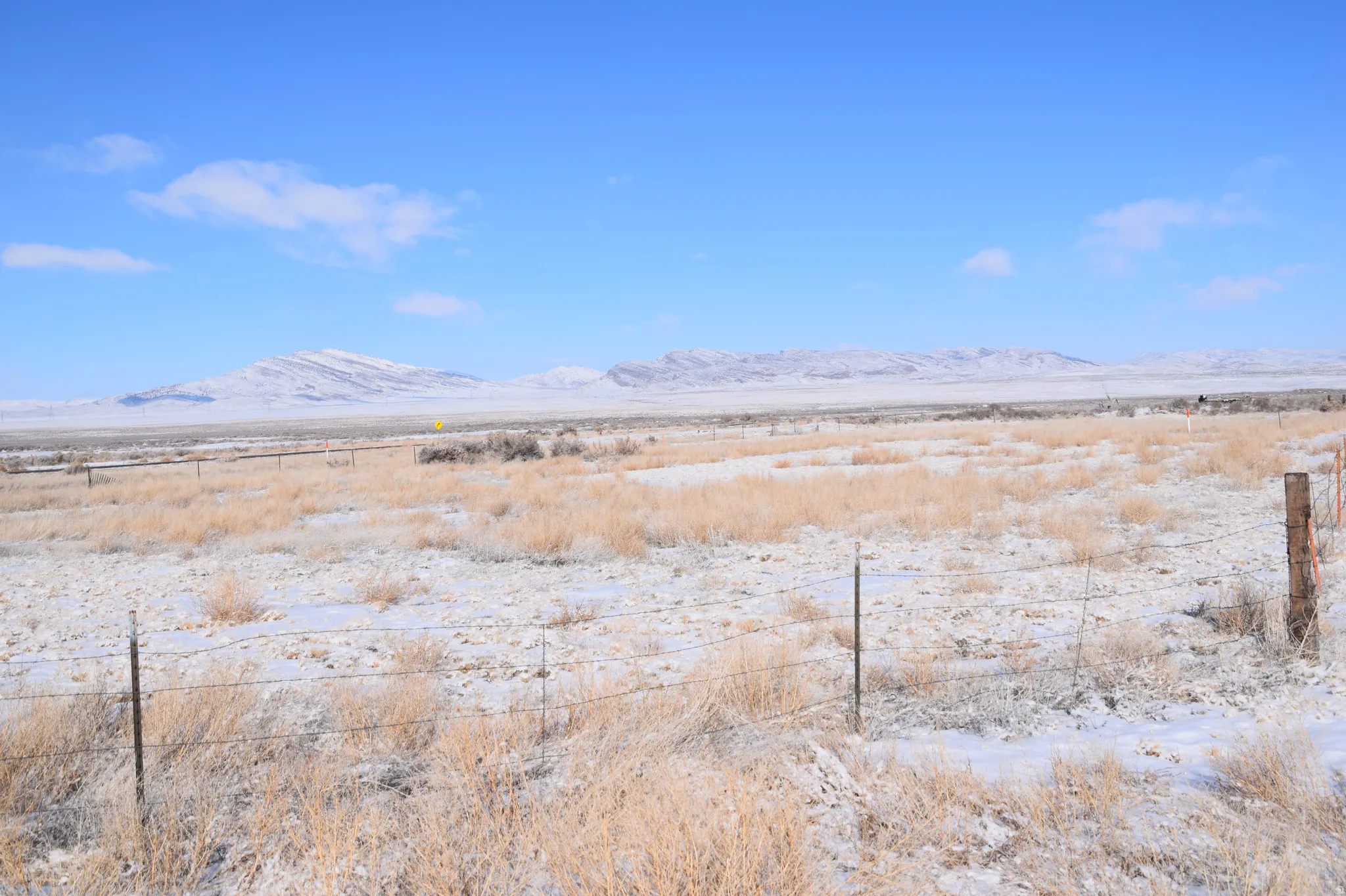 View of mountain background featuring rural landscape
