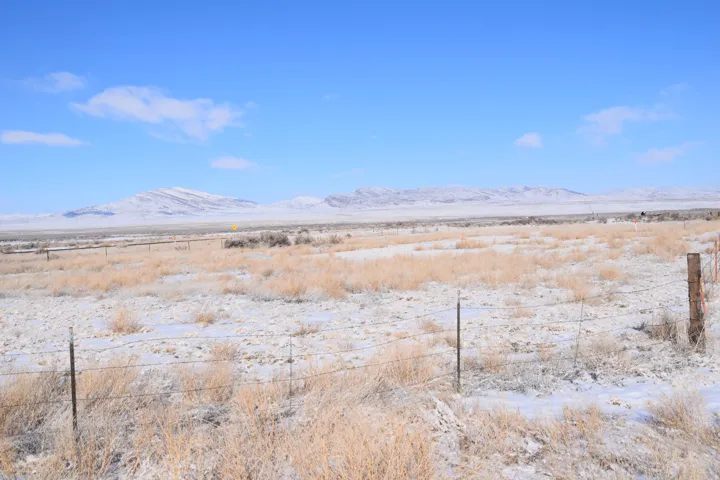 View of mountain background featuring rural landscape