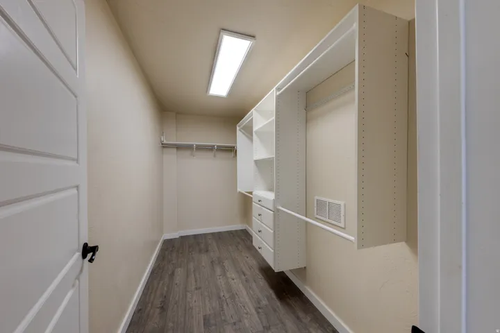 Spacious Primary closet with LVP floors