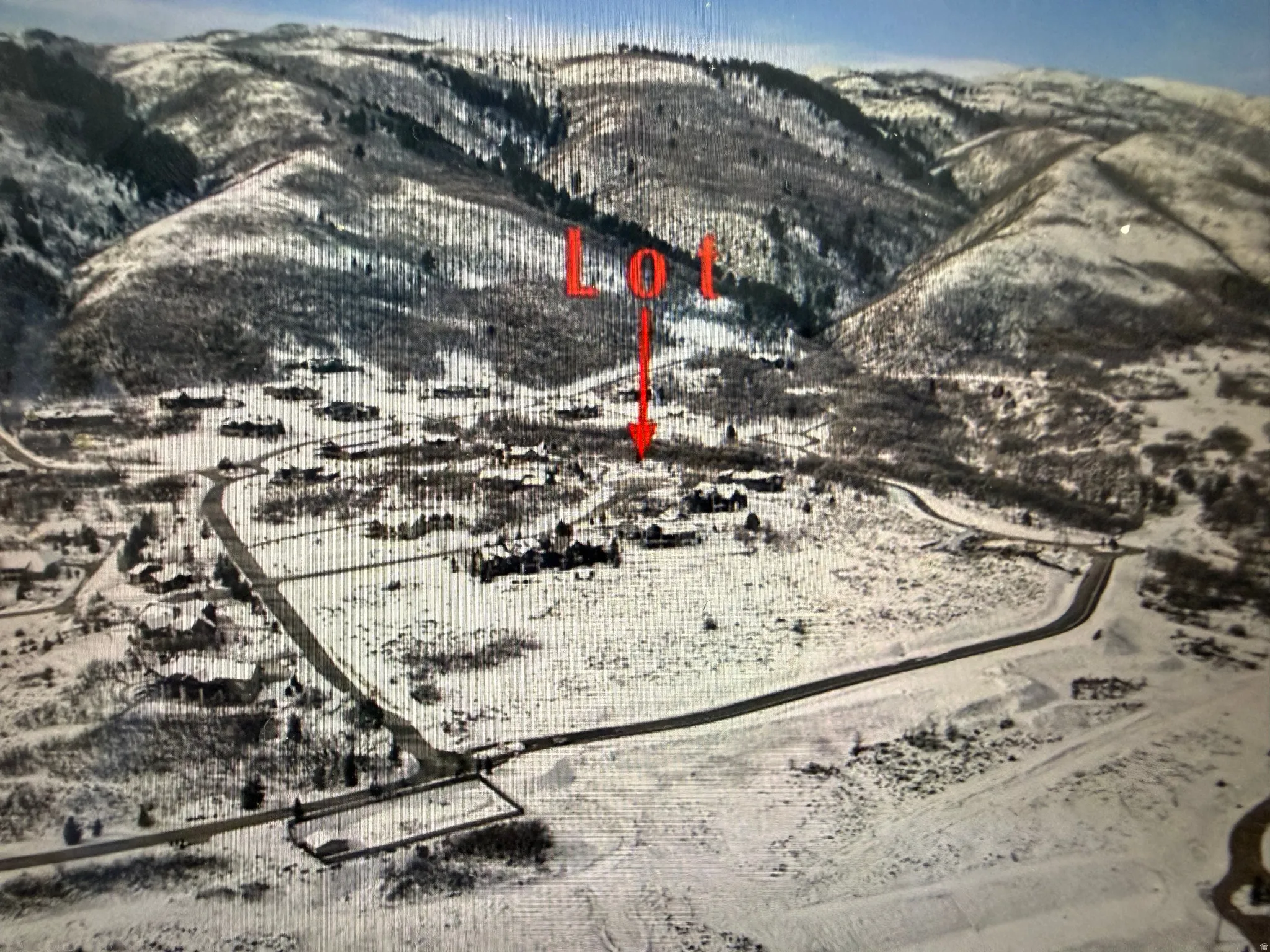 Aerial overview of property's location with mountains