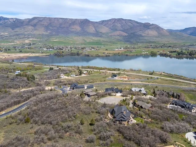 Aerial view of residential area featuring a water and mountain view