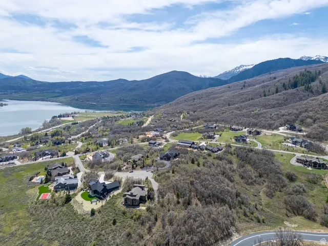 Aerial view of residential area featuring a water and mountain view