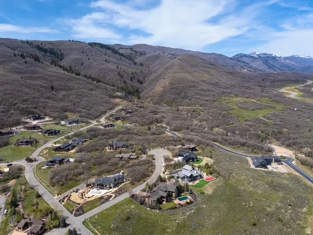 Aerial view of residential area featuring a mountainous background