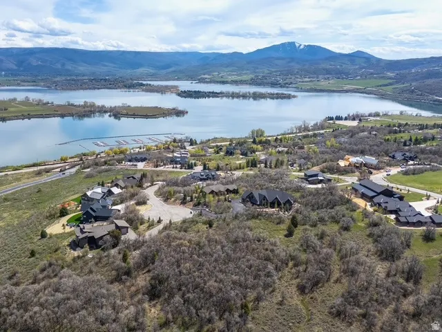 Aerial perspective of suburban area featuring a water and mountain view