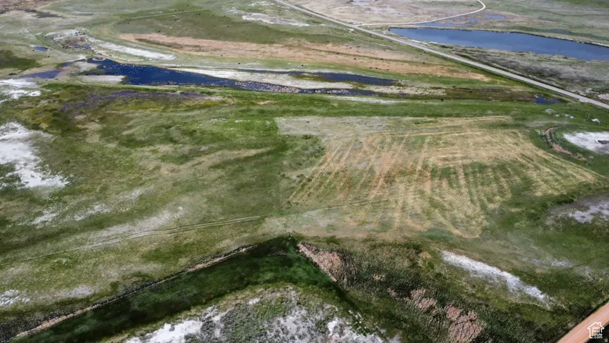 Aerial overview of property's location with a large body of water
