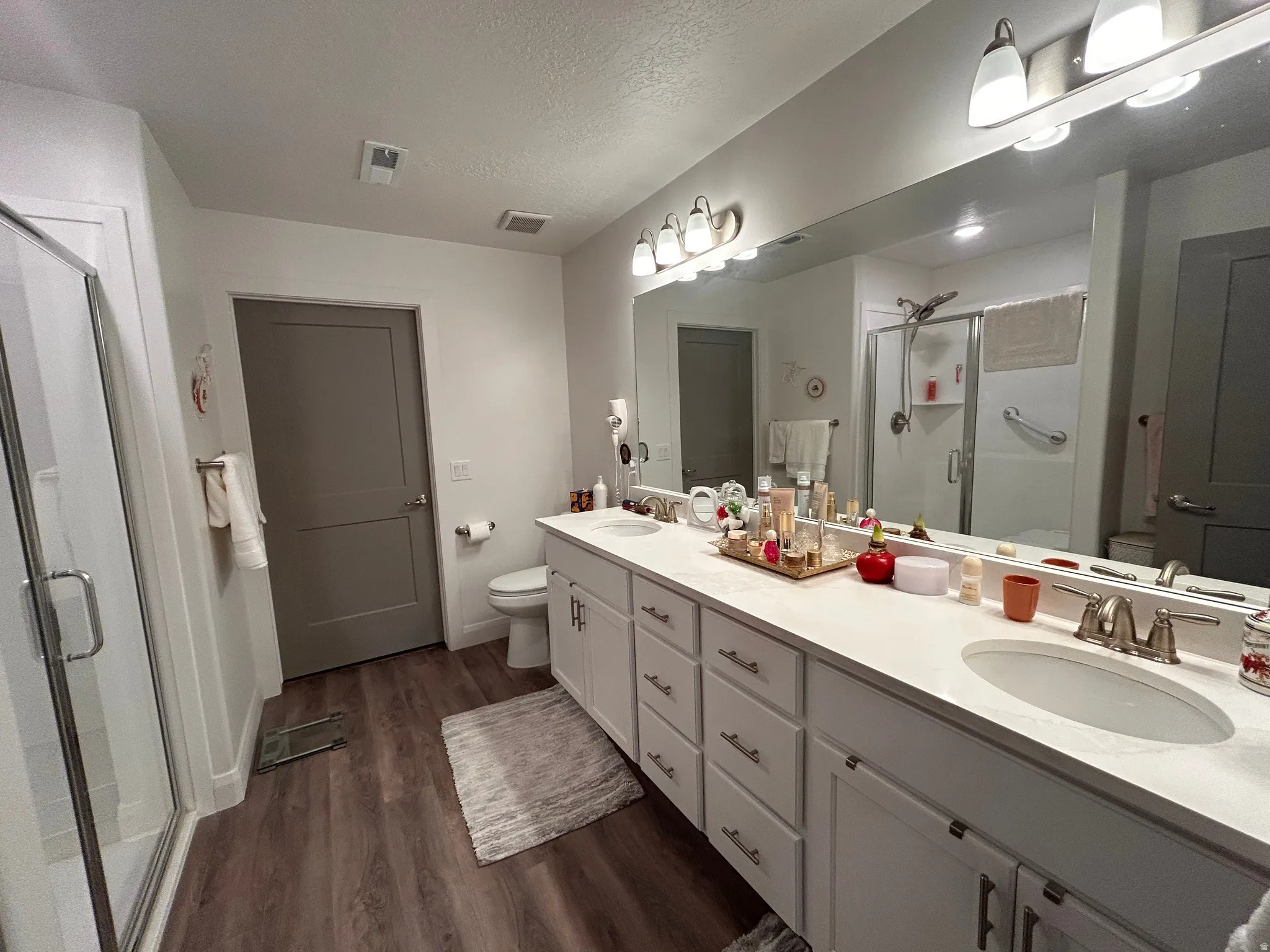 Primary bathroom featuring a beautiful walk in shower