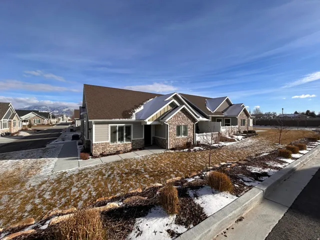 Craftsman house with stone siding and a residential view