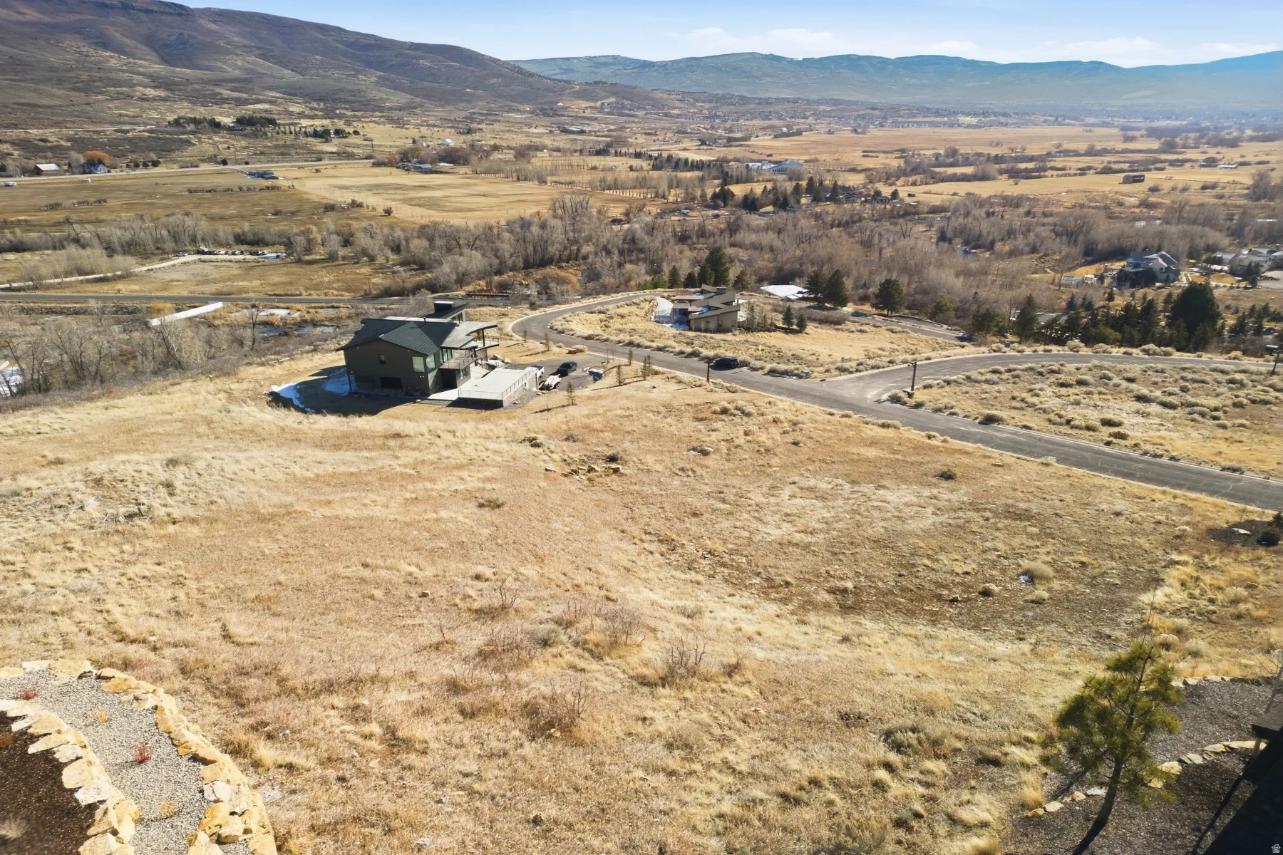 View of property location with a mountain backdrop and rural landscape