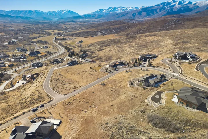 Aerial perspective of suburban area with a mountainous background