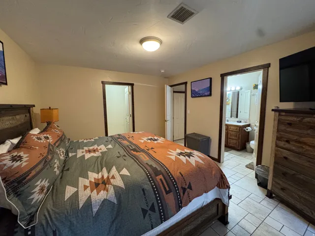 Bedroom featuring connected bathroom
