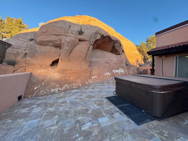 View of patio / terrace with a hot tub