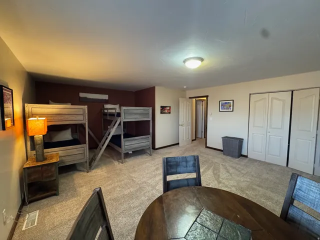 Unfurnished bedroom featuring carpet floors and a closet