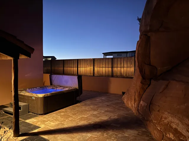 View of patio with a hot tub.  Great privacy.
