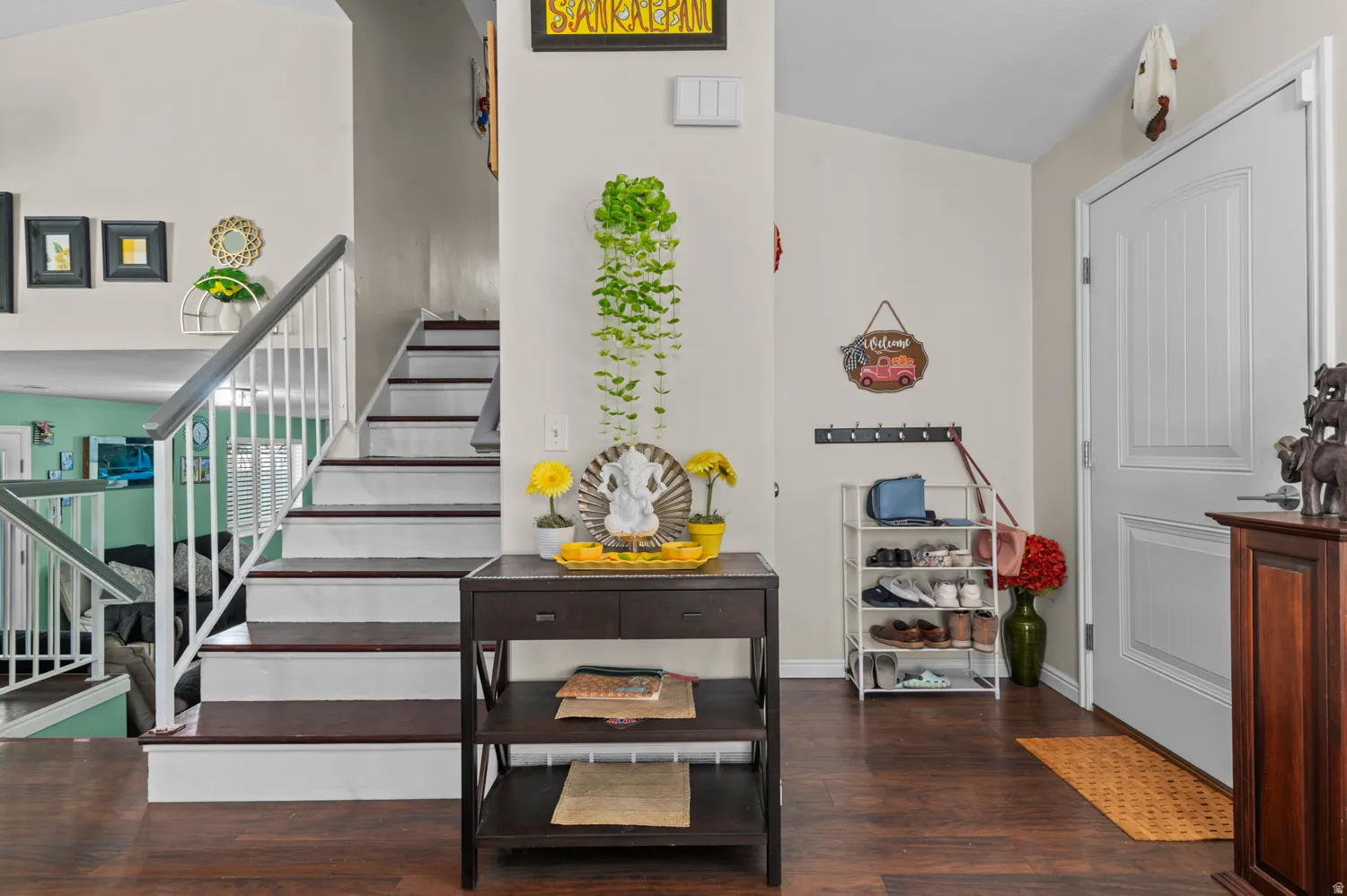 Staircase with wood finished floors and baseboards