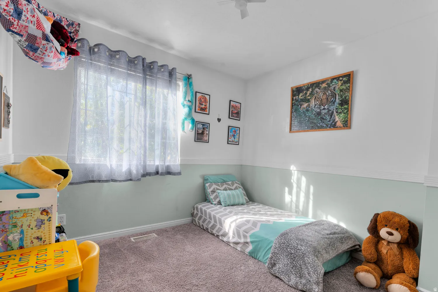 Bedroom with carpet flooring and baseboards