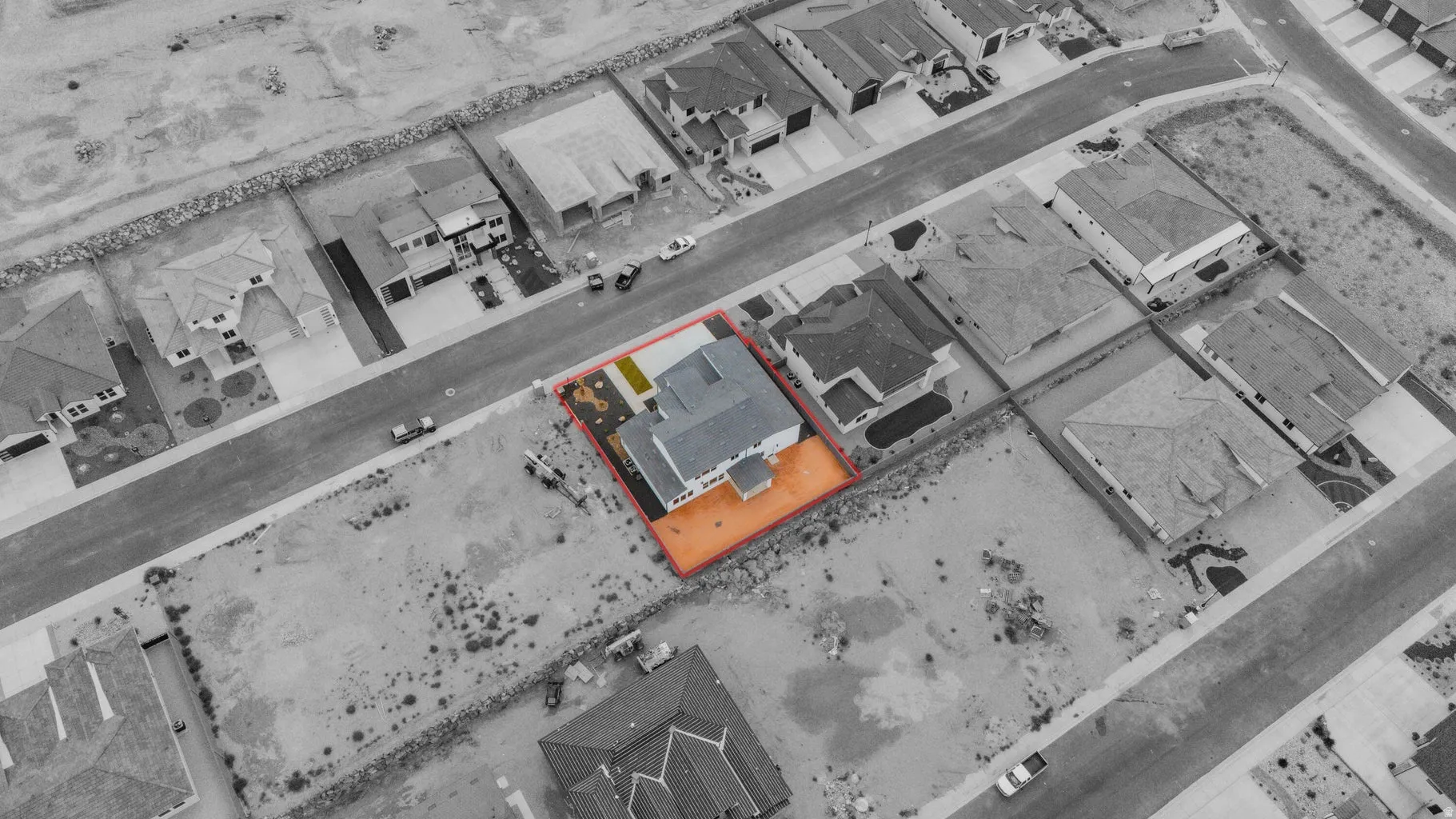 Aerial perspective of suburban area featuring property boundaries highlighted