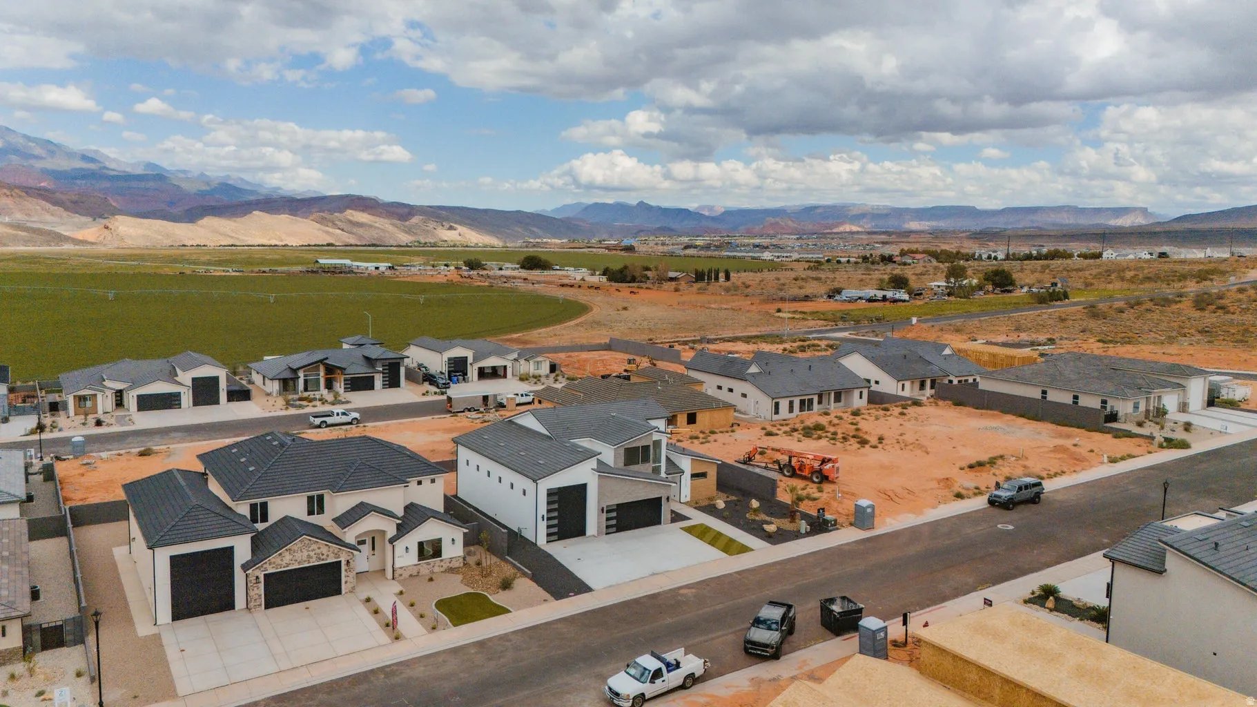 Aerial view of residential area featuring a mountainous background