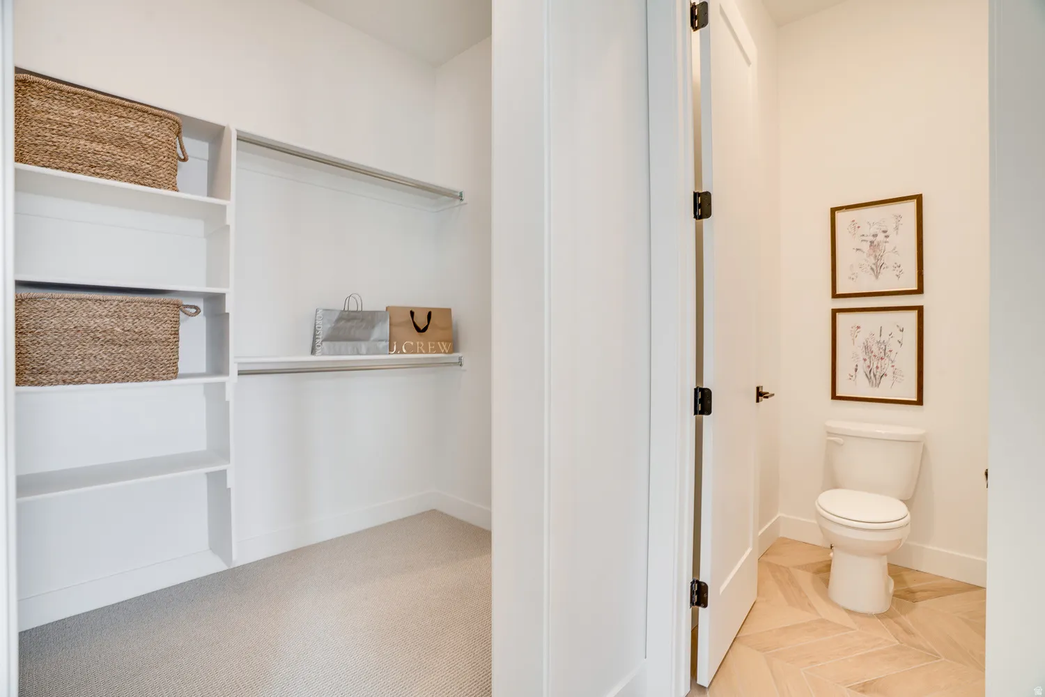 Bathroom with toilet and baseboards