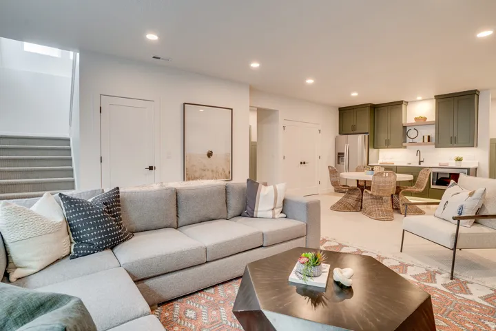 Living room featuring recessed lighting and stairs