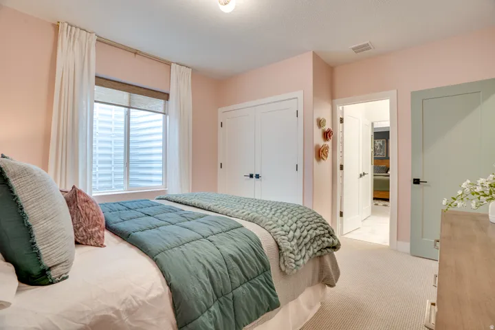 Bedroom with carpet and a closet