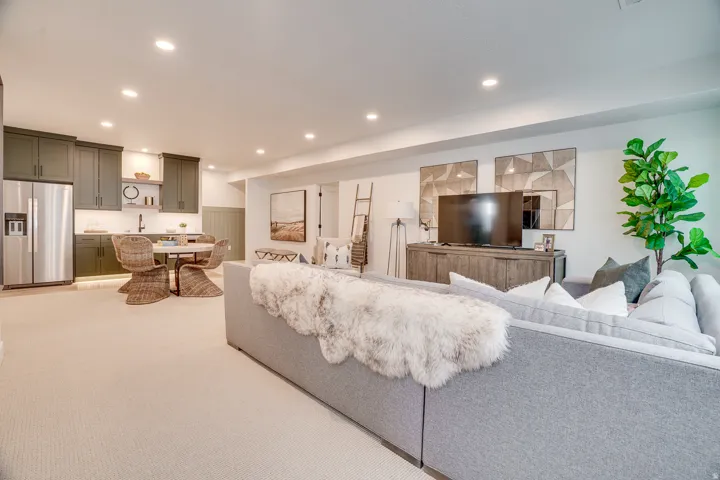 Living room featuring recessed lighting and light carpet