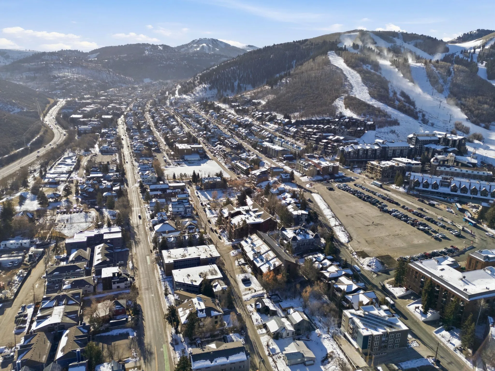 Snowy aerial view featuring a mountain view