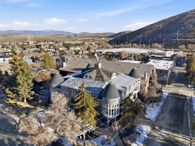 Aerial perspective of suburban area featuring a mountainous background