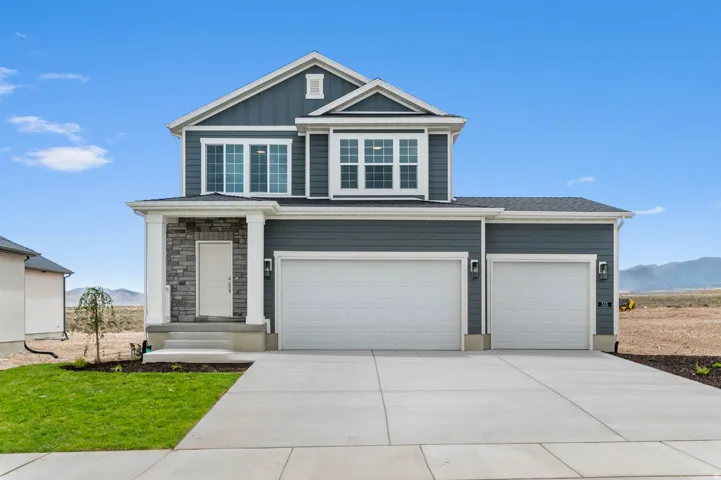 Contemporary two-story residence with a stone-accented front porch