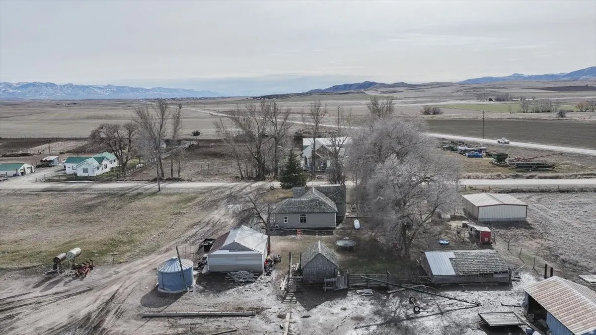 Overview of rural landscape featuring a mountain backdrop