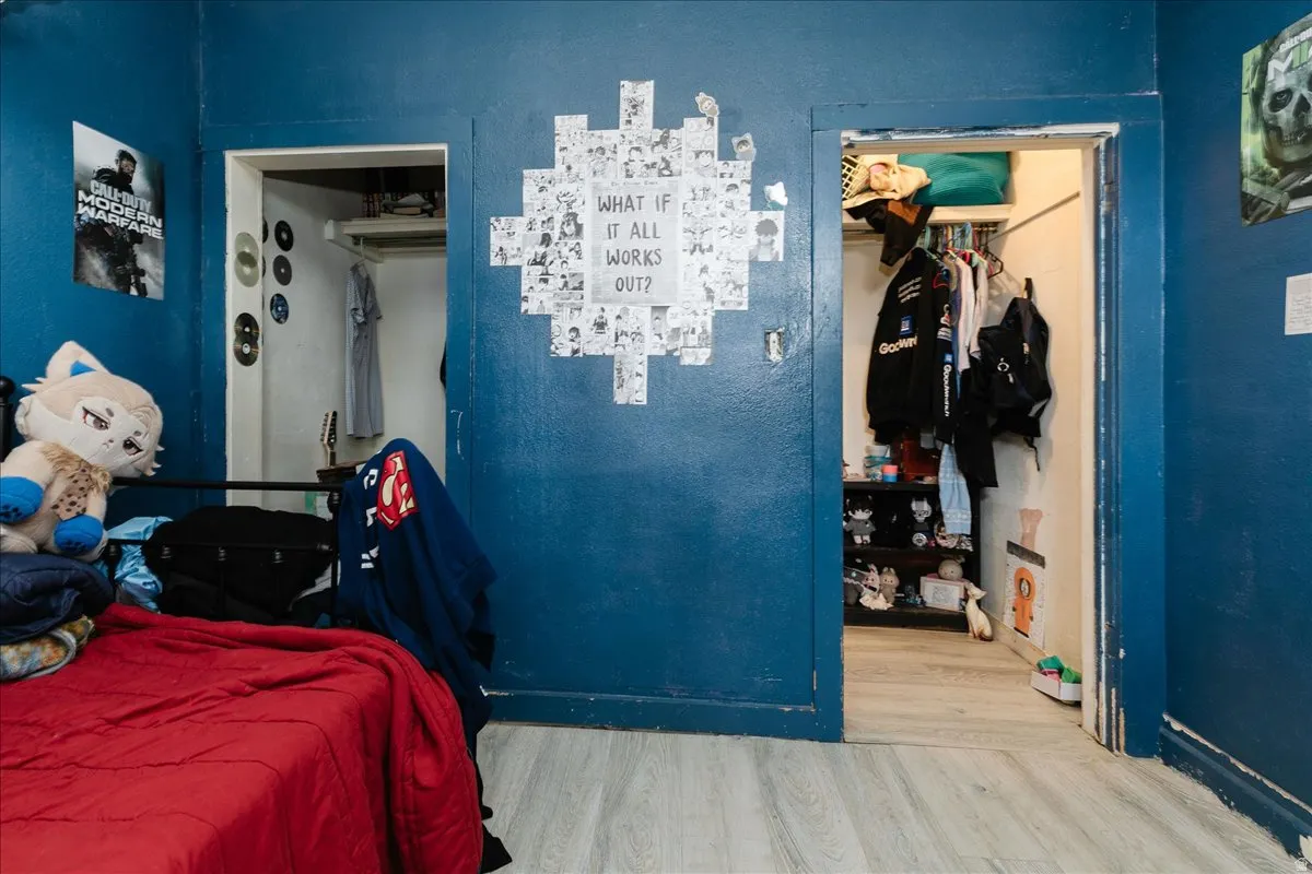 Bedroom featuring a closet and wood finished floors