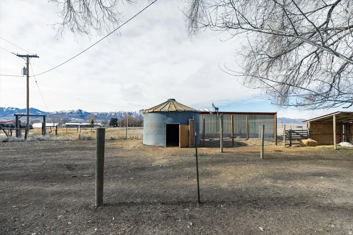 View of pole building featuring a mountain view and a rural view