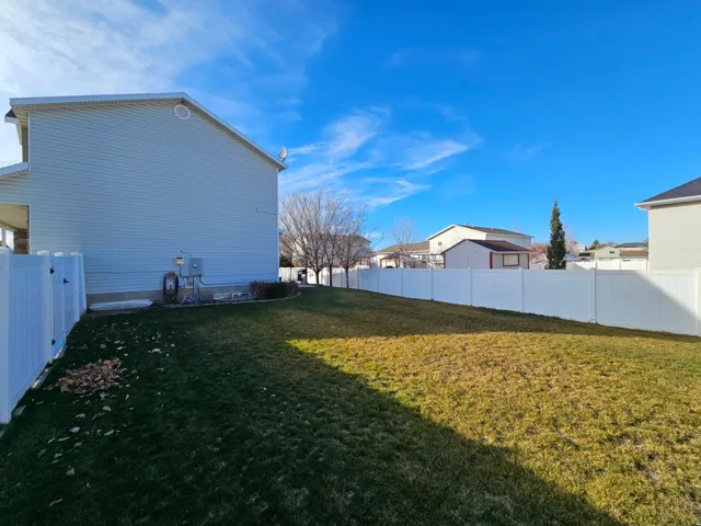 View of fenced backyard