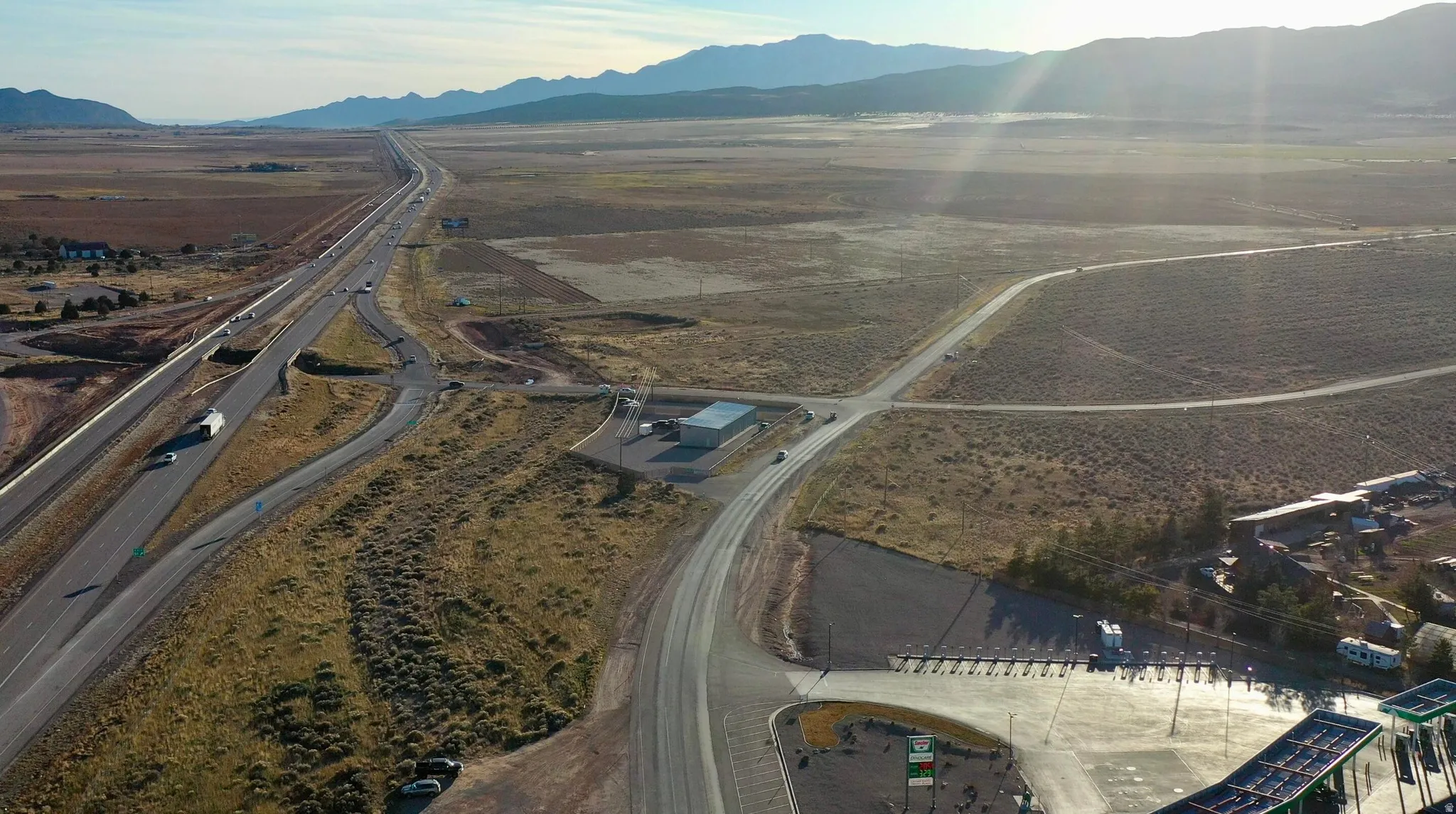 Aerial view of sparsely populated area featuring a mountainous background