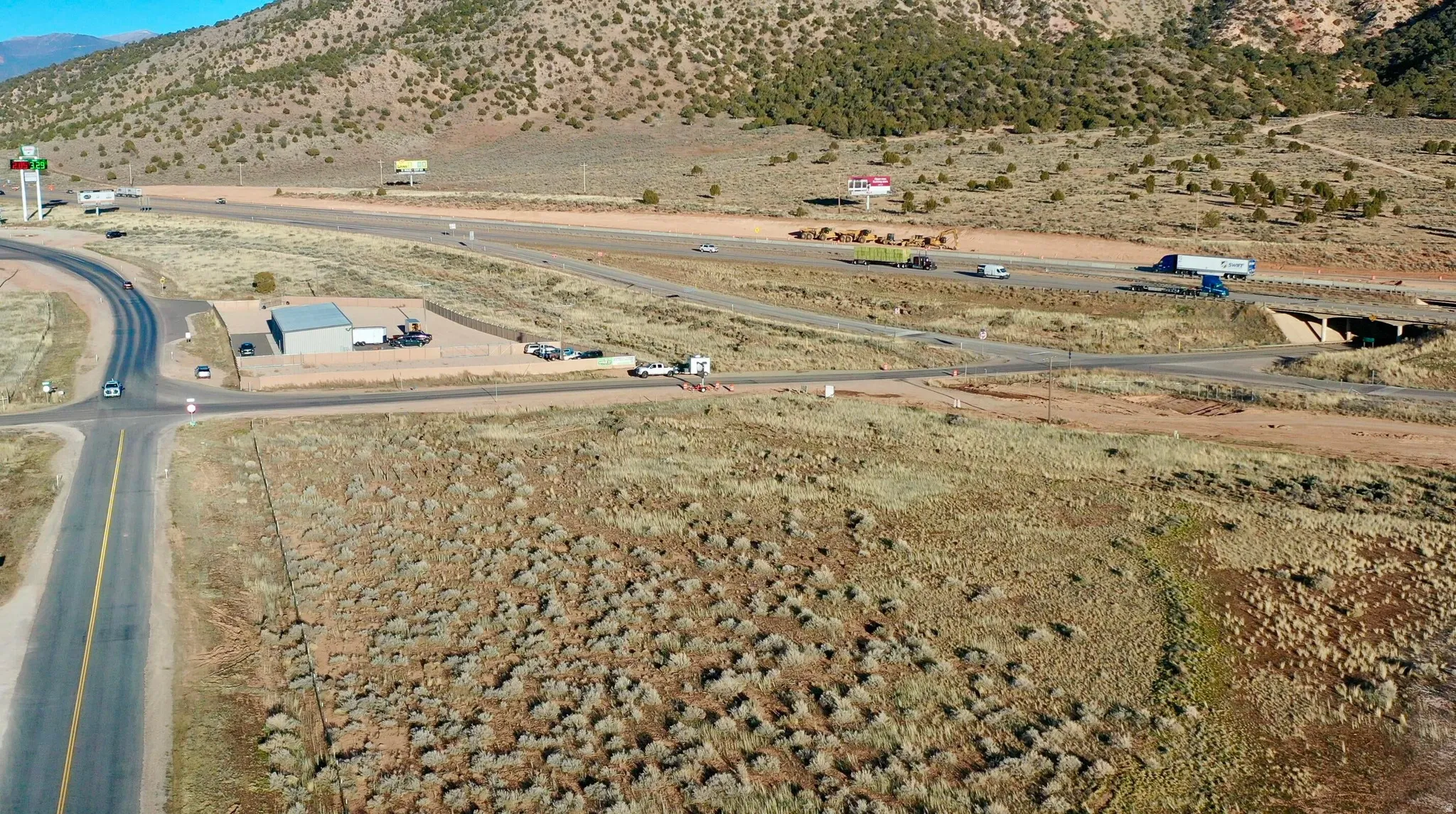 Bird's eye view of a mountain backdrop and a desert landscape