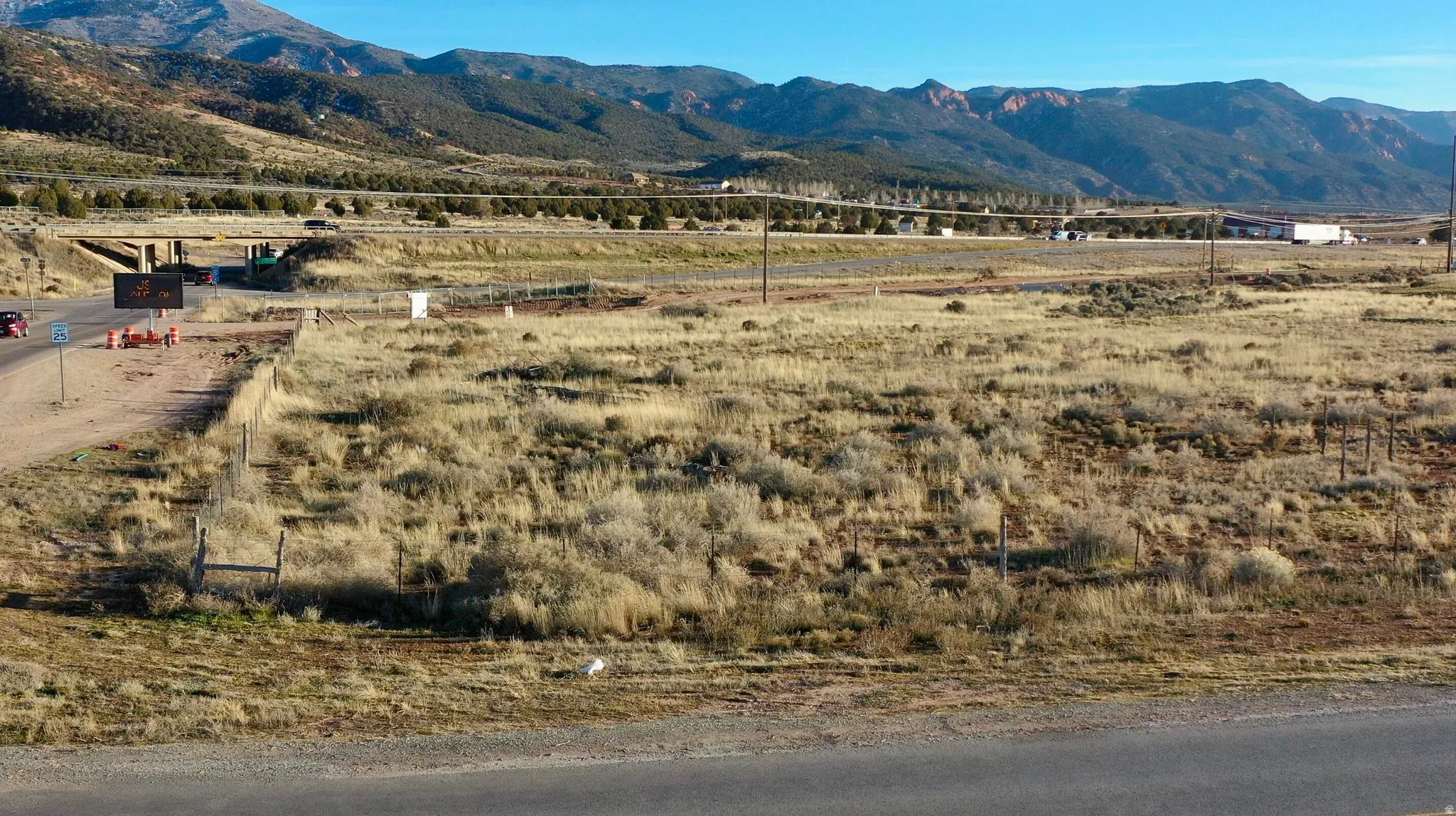 View of mountain backdrop with rural landscape