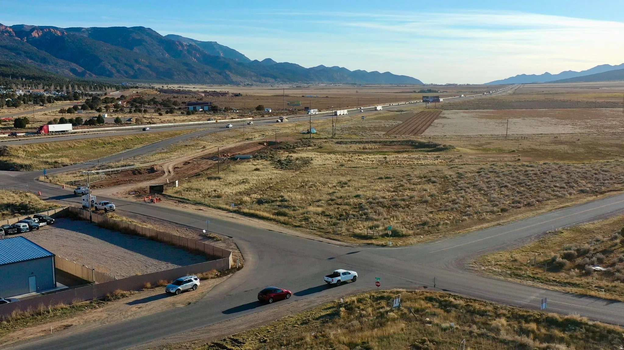 Aerial view of sparsely populated area featuring a mountainous background