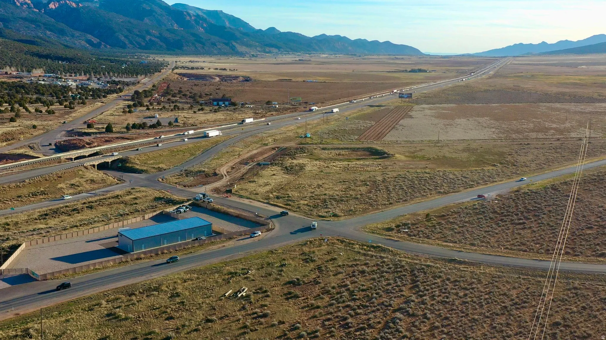 Aerial overview of property's location featuring rural landscape and mountains