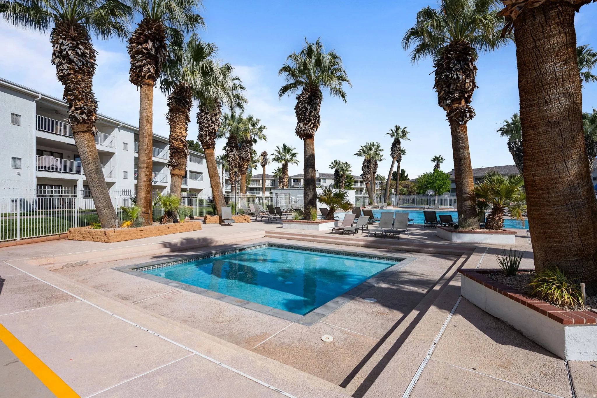 Community pool with a patio