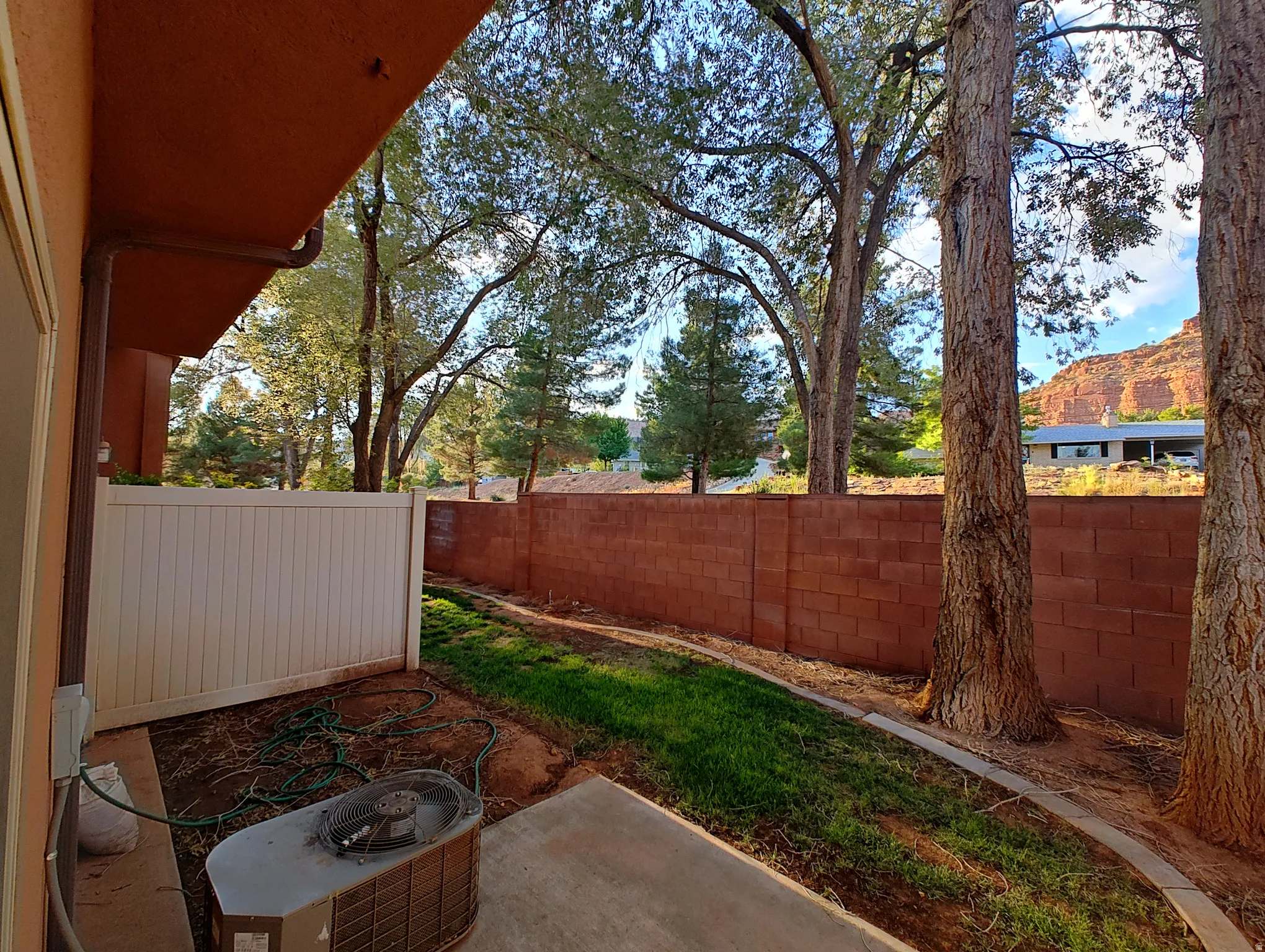 Fenced backyard featuring a patio area