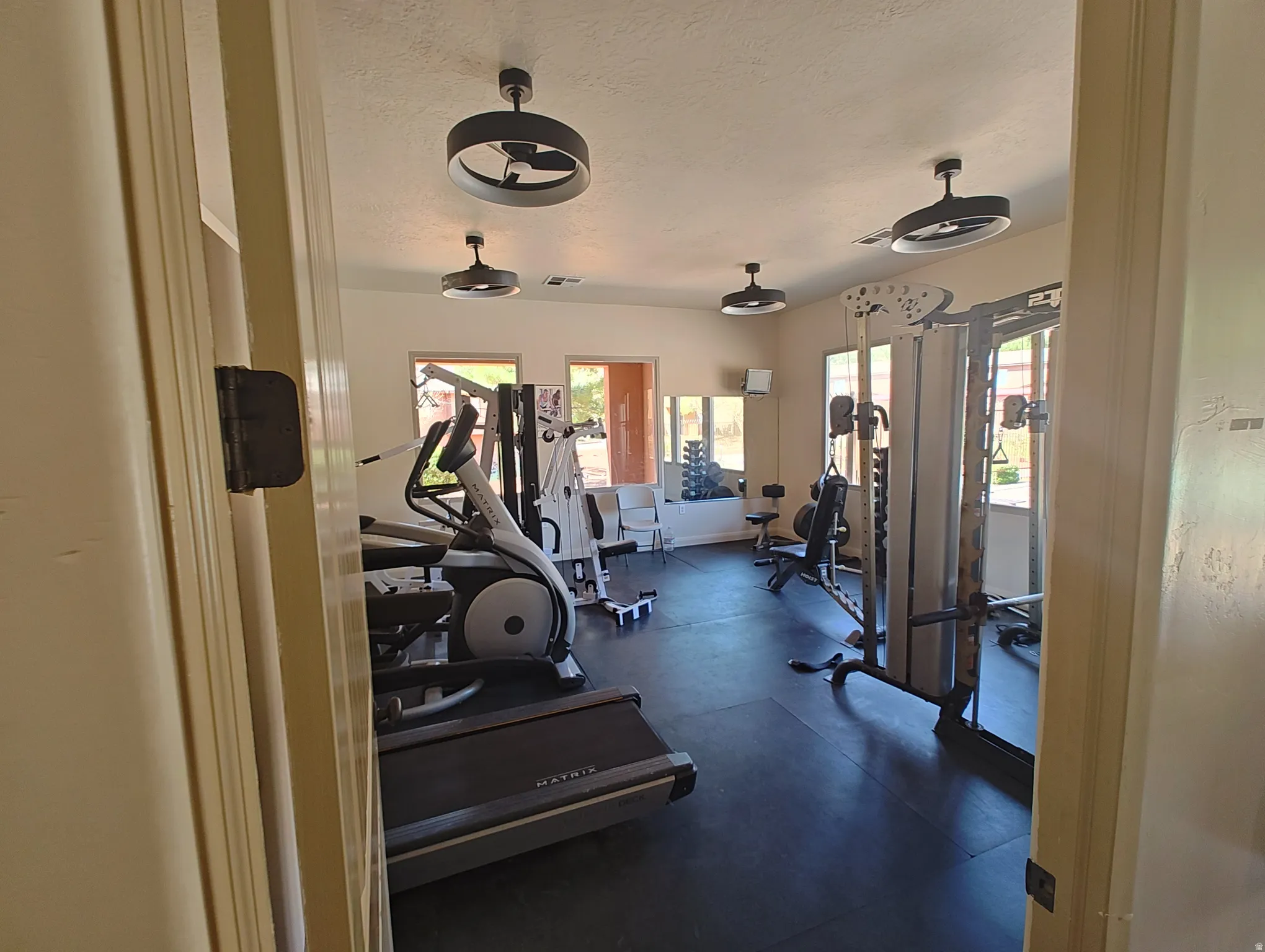 Workout area with a textured ceiling