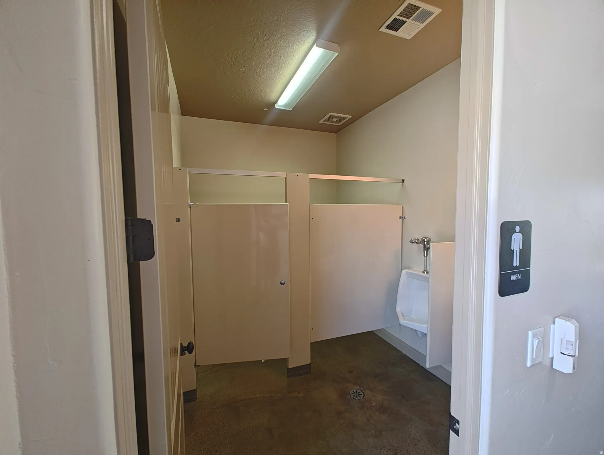 Bathroom featuring concrete flooring